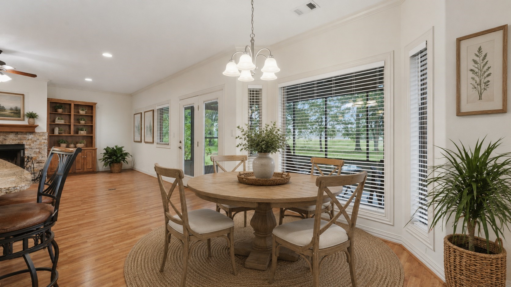 318 Jamestown Road Trinity, TX 75862 - Photo 9 of 44 a dining room with furniture a chandelier and wooden floor