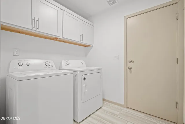 a view of hallway with wooden floor