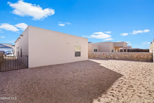 a view of a backyard of the house