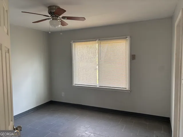 a view of an empty room with a window