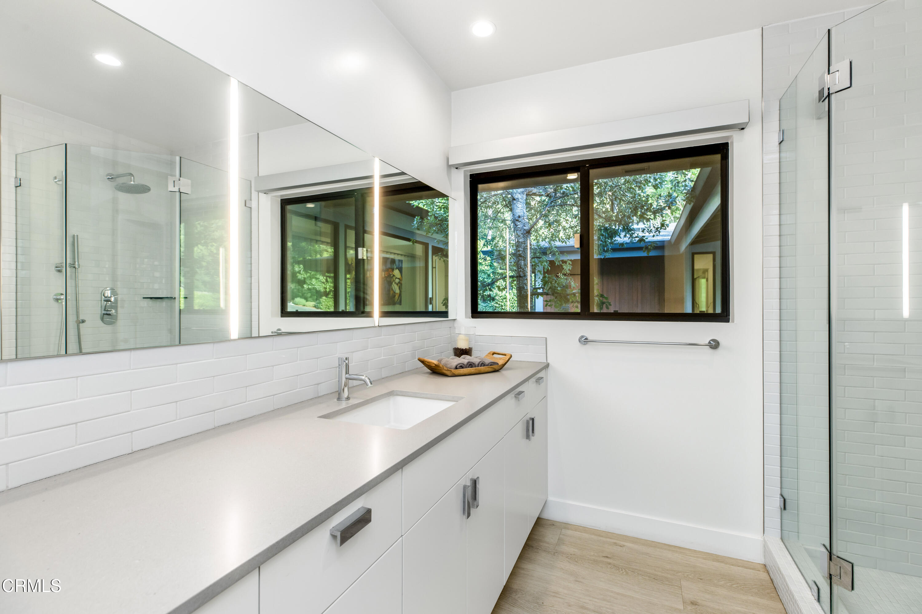 1240 Chateau Road Pasadena, CA 91105 - Photo 35 of 45 a bathroom with a sink and a window
