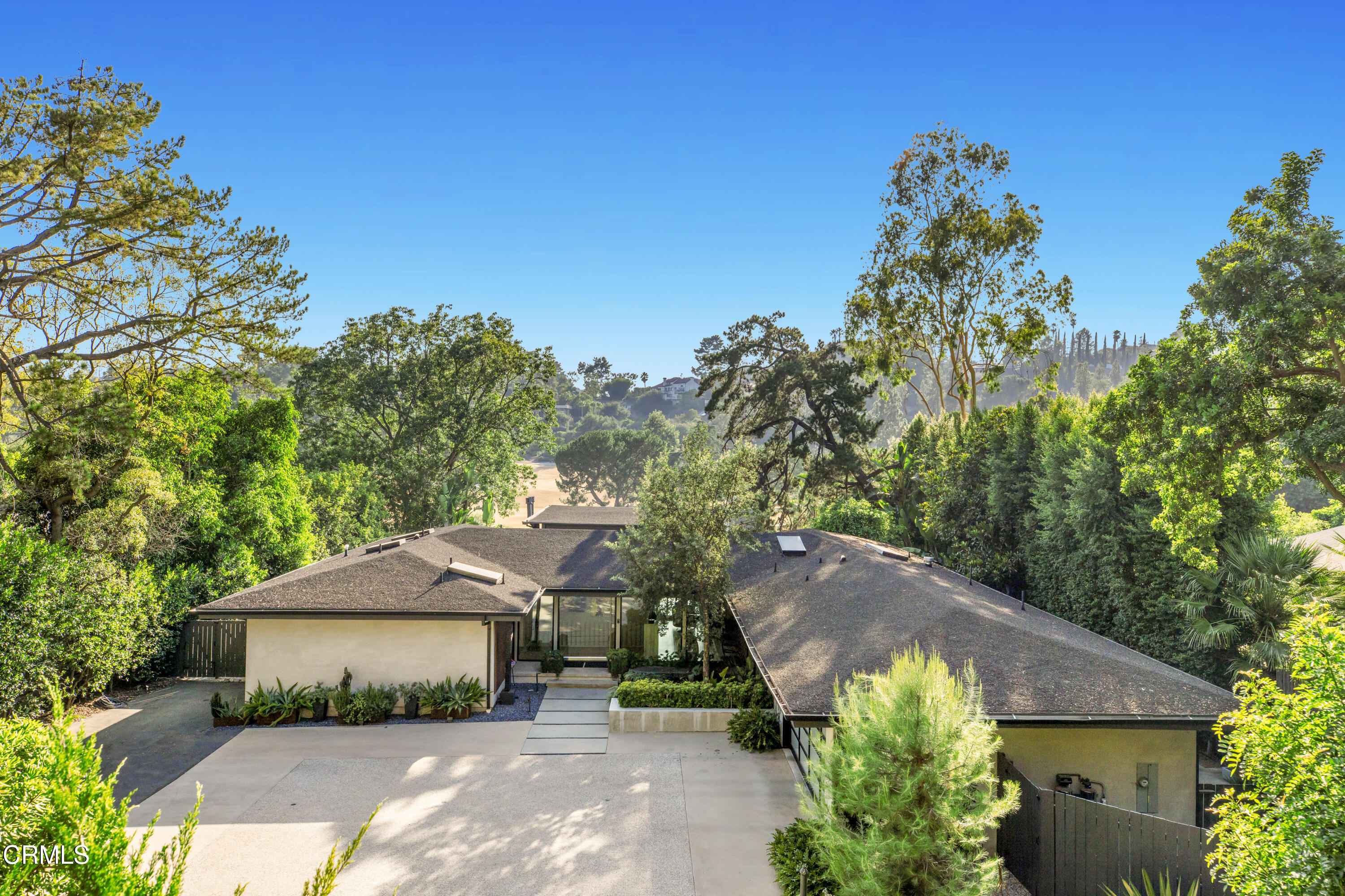 1240 Chateau Road Pasadena, CA 91105 - Photo 43 of 45 a house with trees in the background