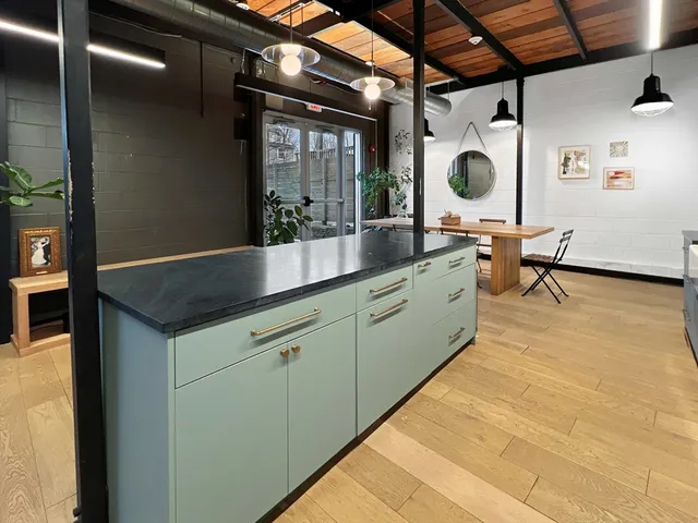 a kitchen with a sink and cabinets