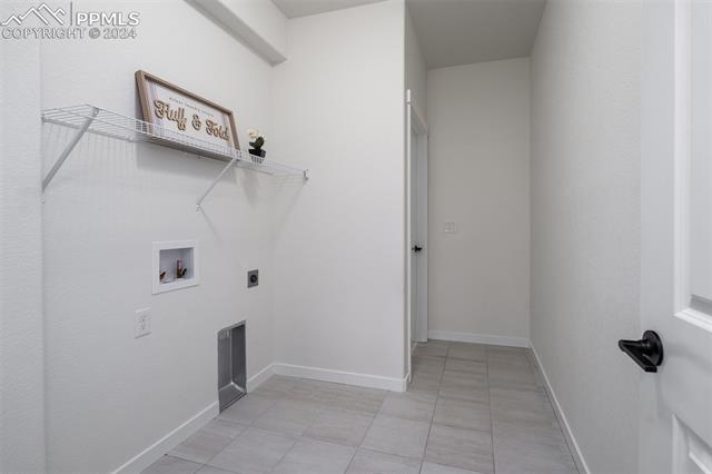 1940 Ruffino Drive Colorado Springs, CO 80921 - Photo 29 of 47 Jack and Jill laundry area from master bath and garage/mud room.