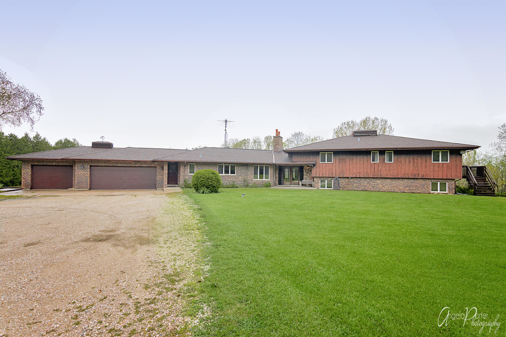 9920 Voss Road Marengo, IL 60152 - Photo 2 of 41 a view of a house with a big yard and large trees