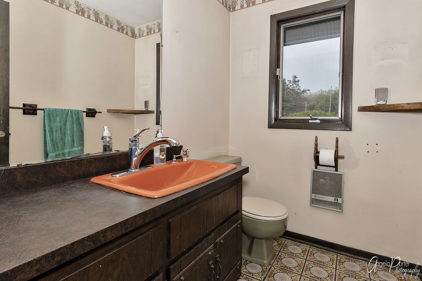 9920 Voss Road Marengo, IL 60152 - Photo 20 of 41 a bathroom with a sink a toilet and a mirror