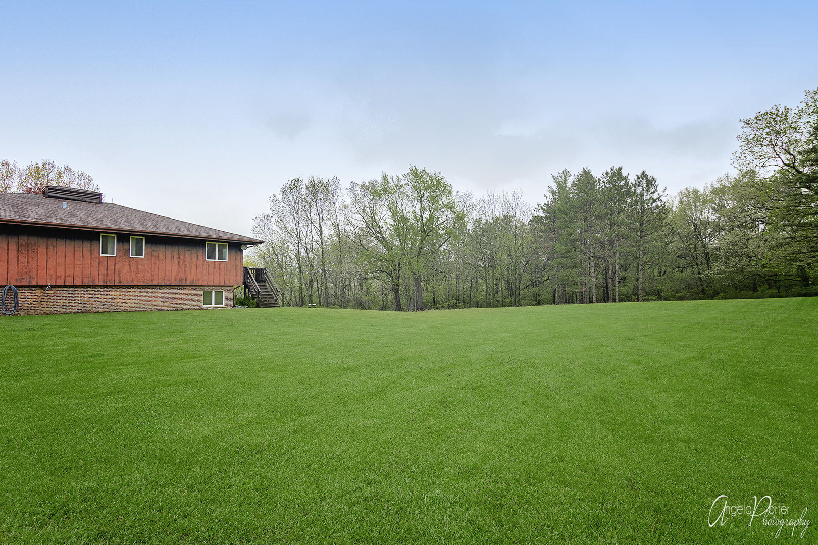 9920 Voss Road Marengo, IL 60152 - Photo 38 of 41 a view of a big house with a big yard