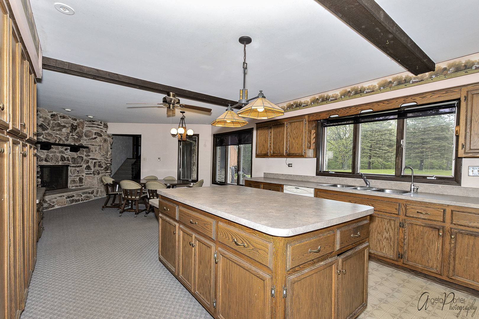 9920 Voss Road Marengo, IL 60152 - Photo 6 of 41 a kitchen that has a lot of cabinets in it