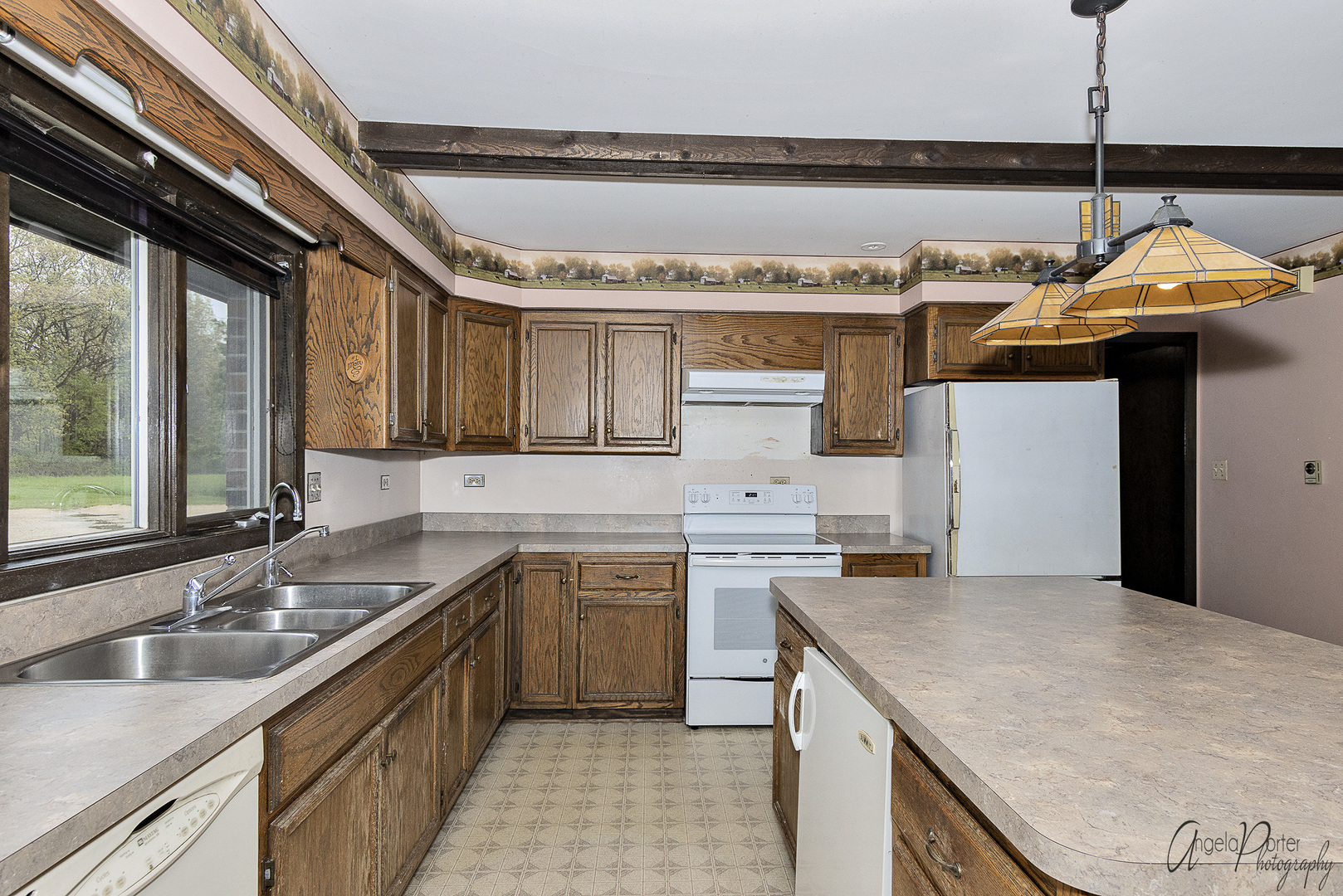 9920 Voss Road Marengo, IL 60152 - Photo 8 of 41 a kitchen with stainless steel appliances granite countertop a sink a stove and a wooden floors