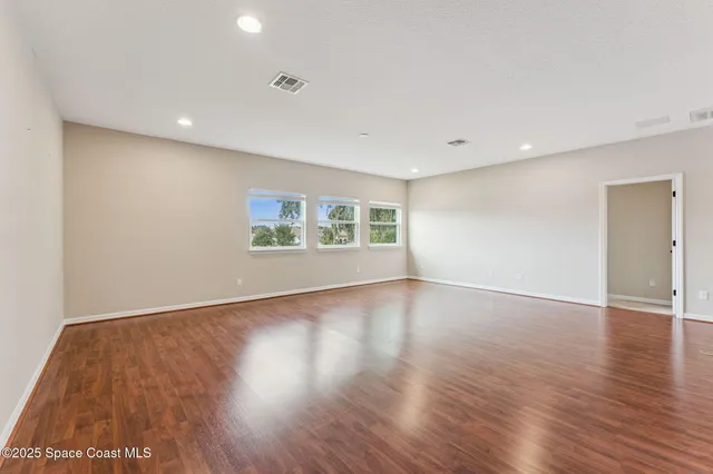 a spacious bathroom with a tub shower and sink