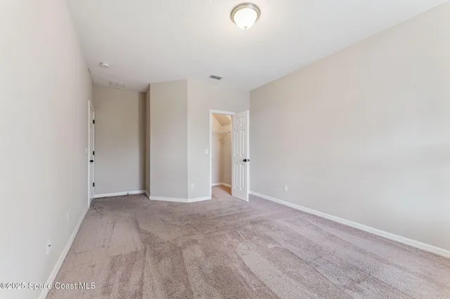 a view of a house with backyard porch and sitting area
