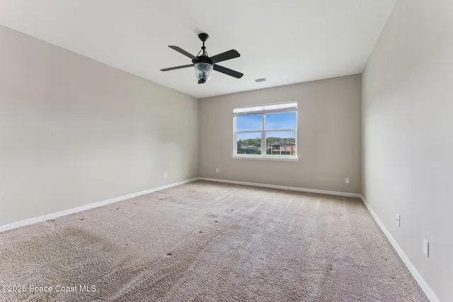 an aerial view of a house with a garden space
