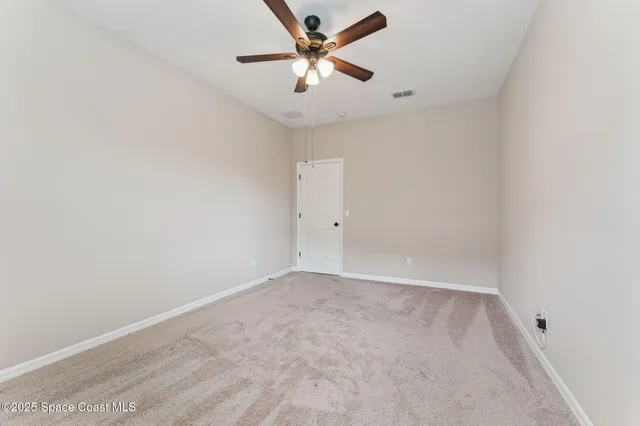 an aerial view of multiple houses with yard