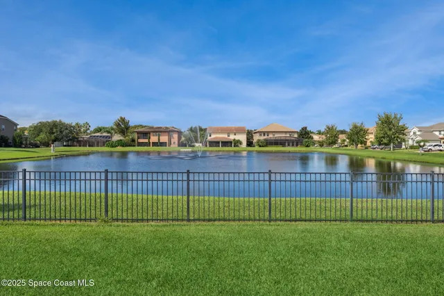 an aerial view of a house with a garden and plants