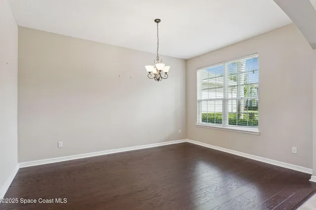 a kitchen with stainless steel appliances granite countertop a refrigerator a sink and a stove