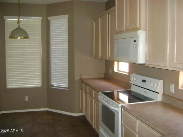 a kitchen that has a sink and a stove