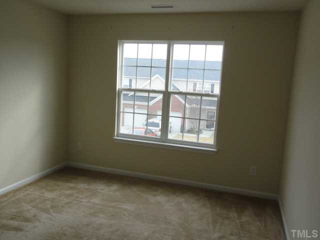3545 Oneonta Avenue Raleigh, NC 27604 - Photo 8 of 10 an empty room with a window