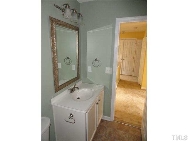 3545 Oneonta Avenue Raleigh, NC 27604 - Photo 9 of 10 a bathroom with a sink a mirror and a