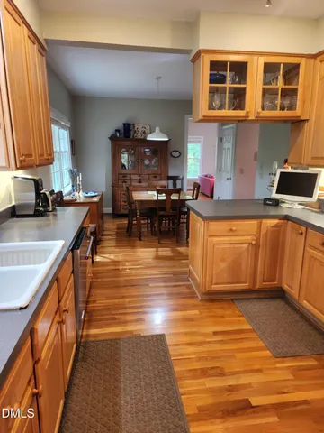 a kitchen with stainless steel appliances granite countertop a sink and cabinets