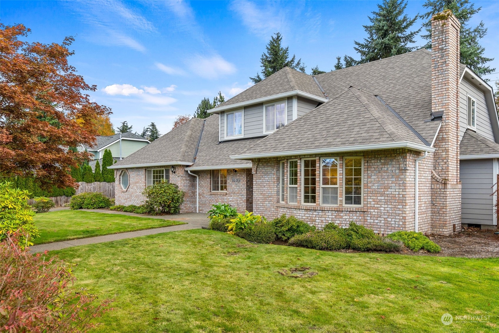 8019 68th Loop Southeast Olympia, WA 98513 - Photo 2 of 40 a front view of a house with a yard