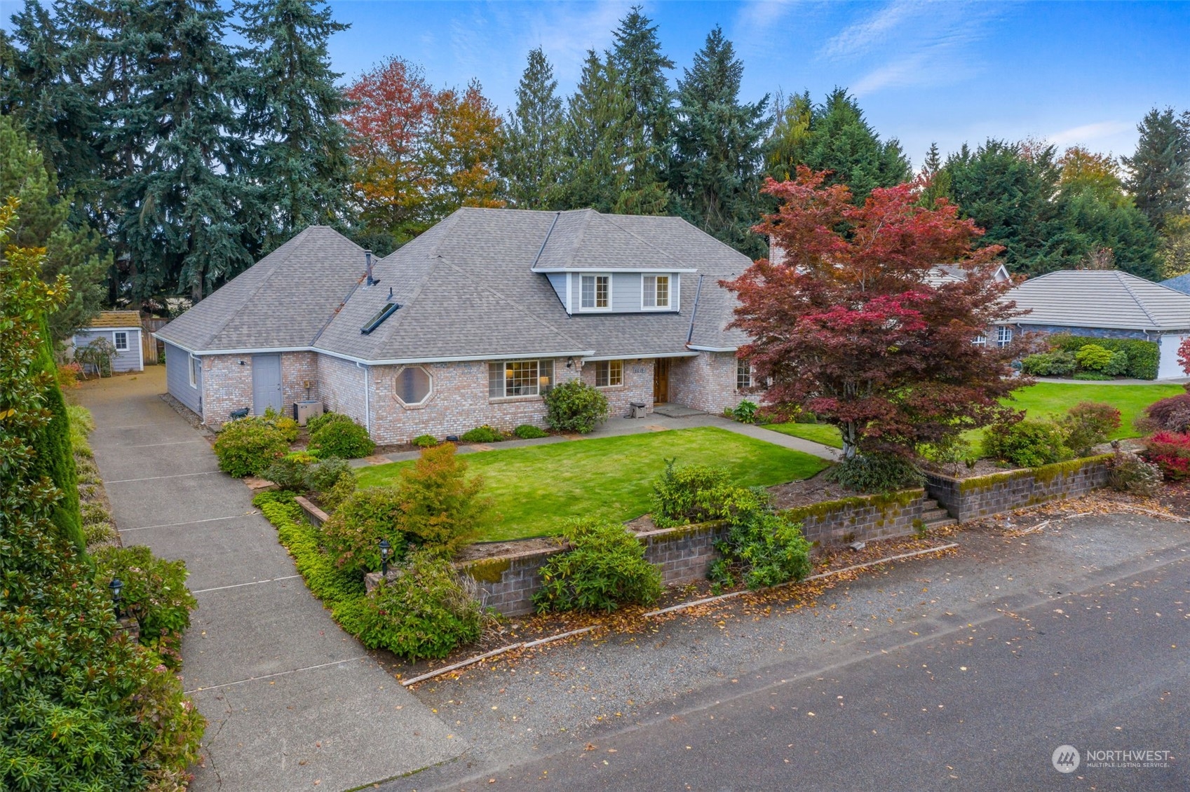 8019 68th Loop Southeast Olympia, WA 98513 - Photo 3 of 40 a front view of a house with a garden