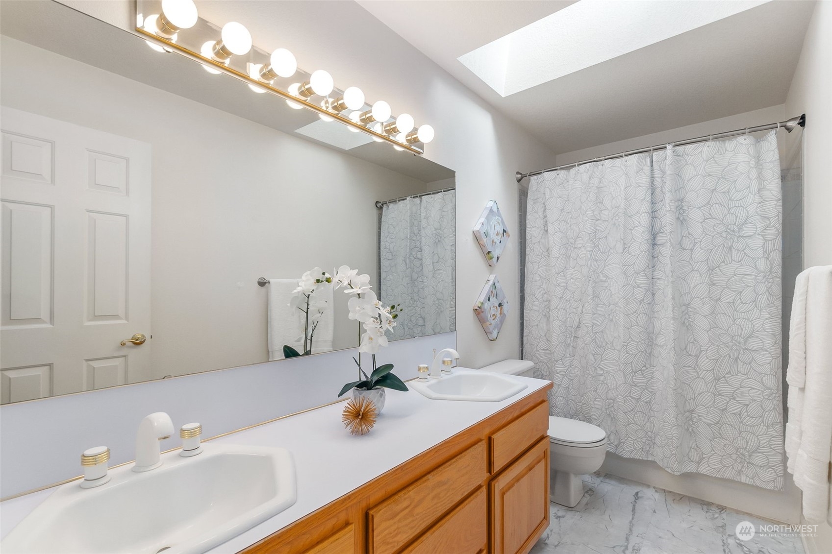8019 68th Loop Southeast Olympia, WA 98513 - Photo 37 of 40 a bathroom with a sink double vanity and a shower