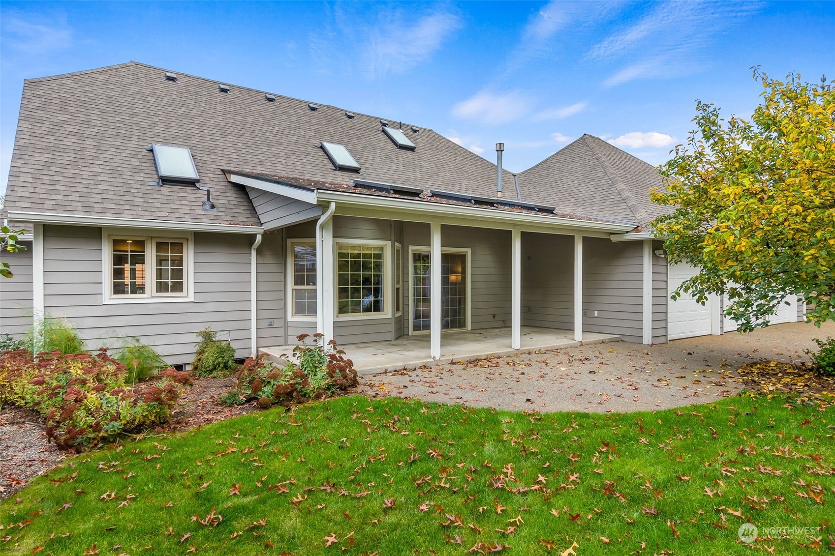 8019 68th Loop Southeast Olympia, WA 98513 - Photo 8 of 40 a front view of a house with garden