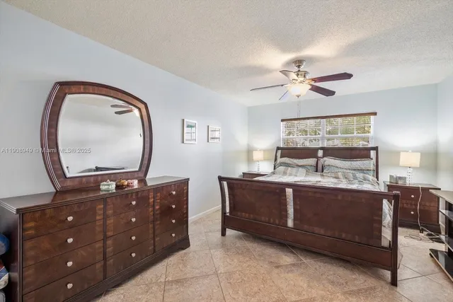 a living room with furniture and a mirror