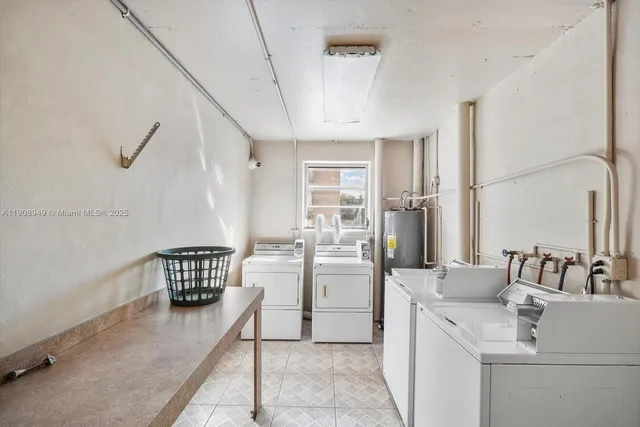 a kitchen with refrigerator and cabinets