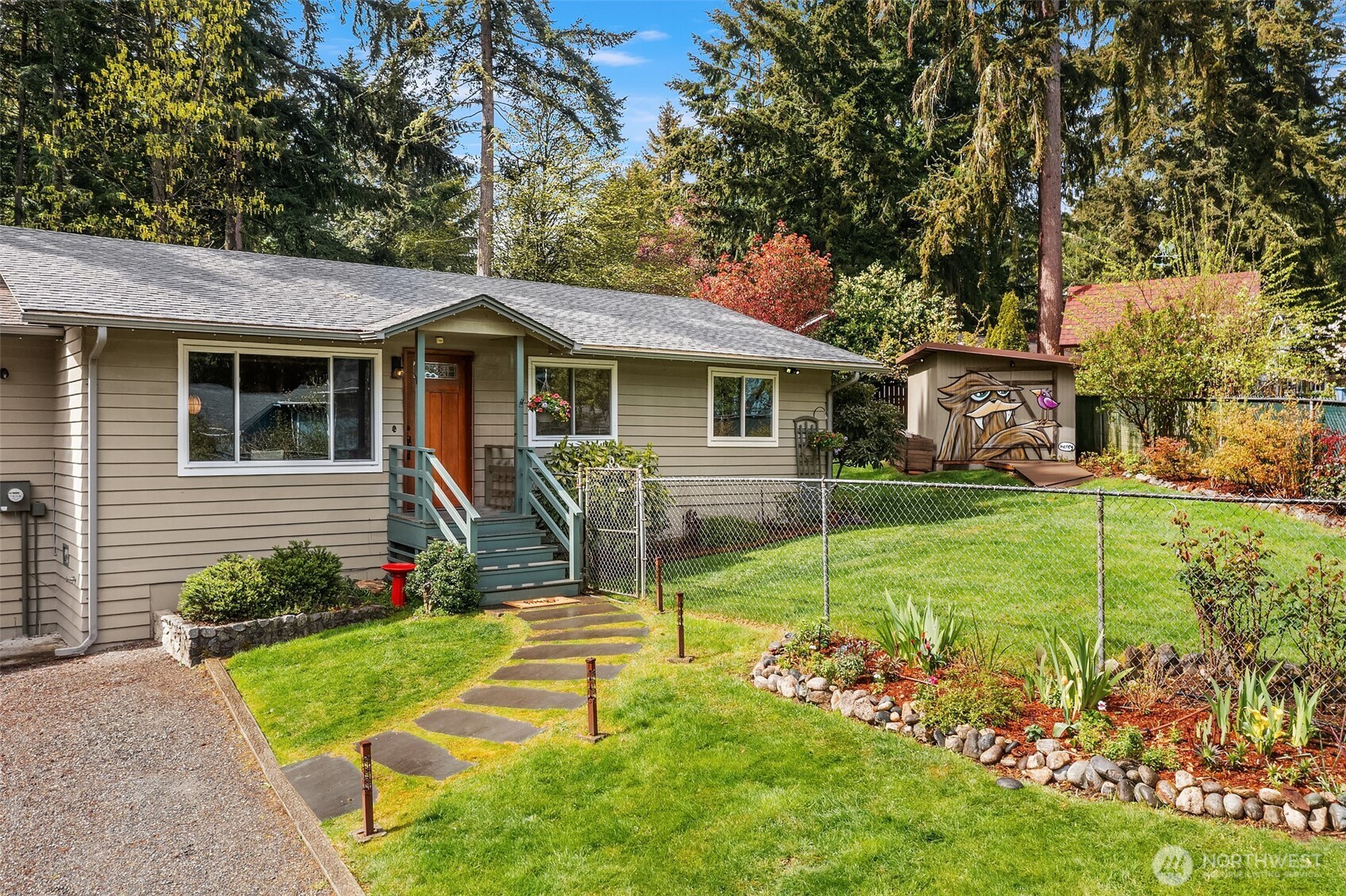 19047 87th Place Southwest Vashon, WA 98070 - Photo 1 of 23 a view of a house with a backyard and a tree