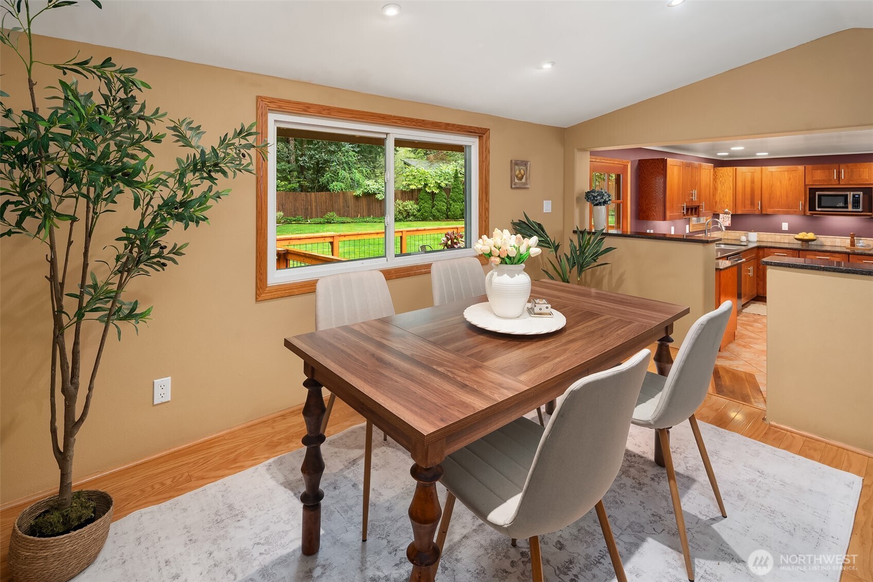 19047 87th Place Southwest Vashon, WA 98070 - Photo 12 of 23 a dining room with furniture a window and wooden floor
