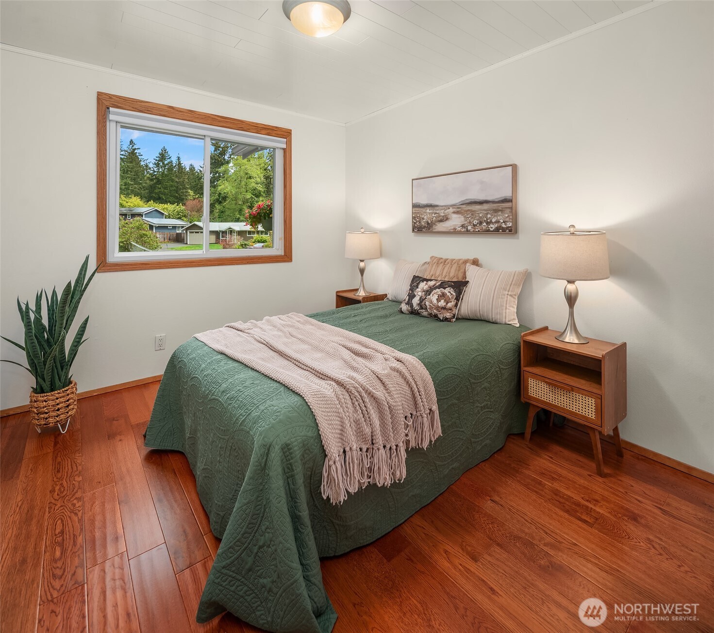 19047 87th Place Southwest Vashon, WA 98070 - Photo 14 of 23 a bedroom with a bed lamp closet and window