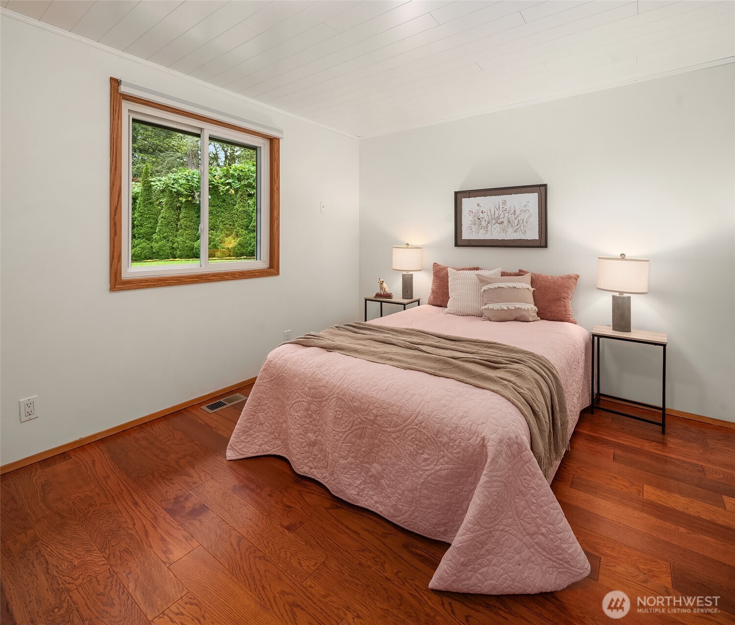 19047 87th Place Southwest Vashon, WA 98070 - Photo 15 of 23 a bedroom with a bed and a window