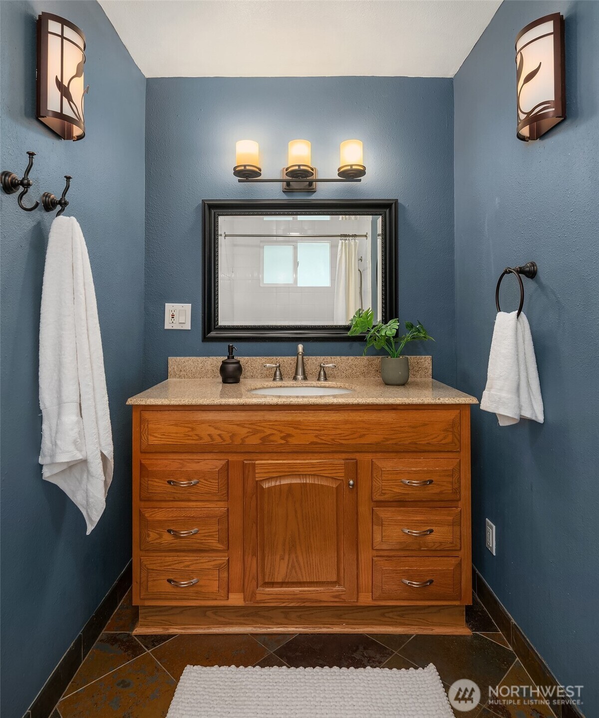 19047 87th Place Southwest Vashon, WA 98070 - Photo 16 of 23 a bathroom with a sink and a mirror
