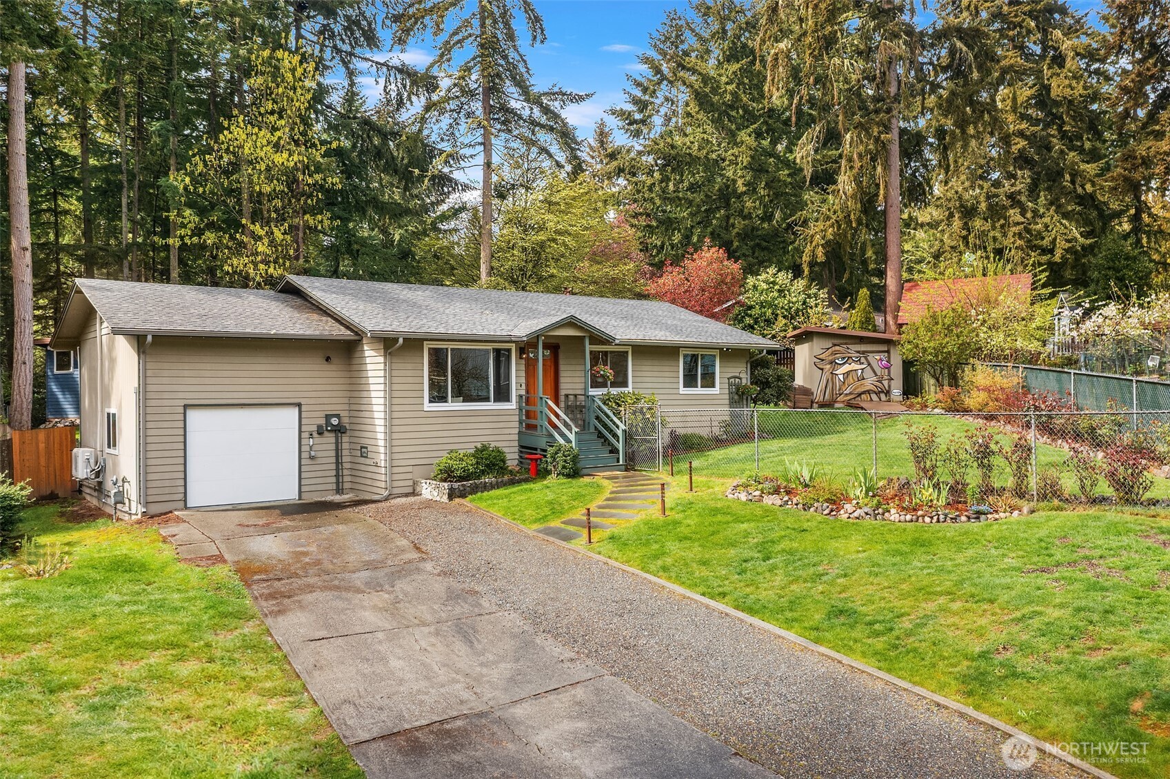 19047 87th Place Southwest Vashon, WA 98070 - Photo 23 of 23 a front view of a house with a yard