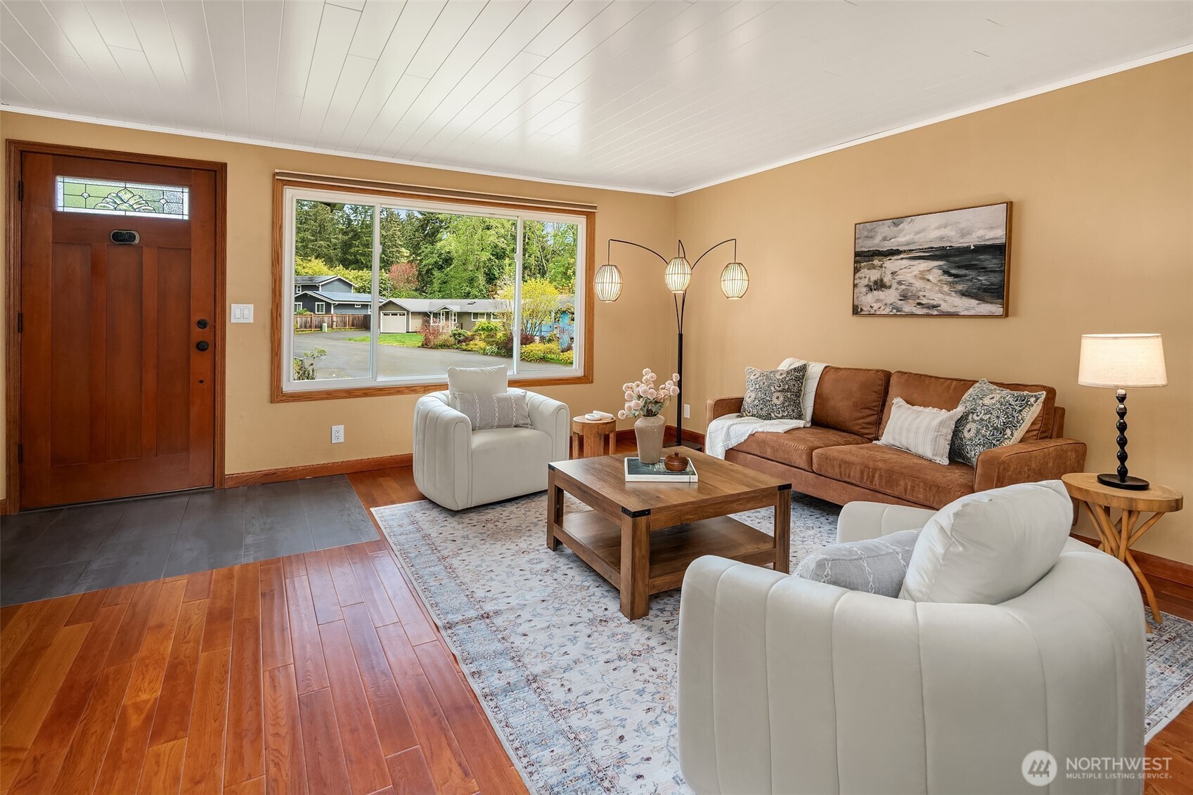 19047 87th Place Southwest Vashon, WA 98070 - Photo 5 of 23 a living room with furniture and a large window
