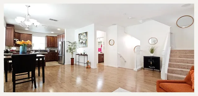 a kitchen with a table and chairs in it