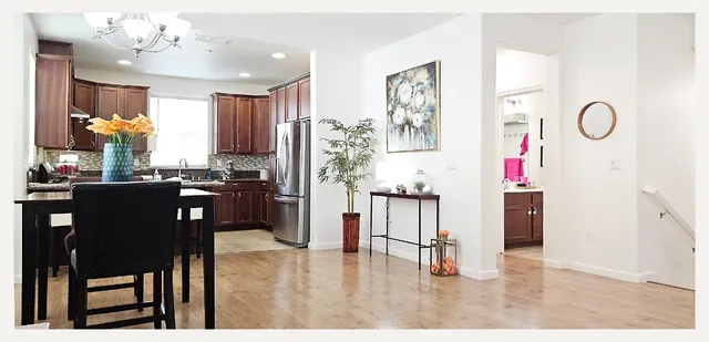 a view of a dining room with furniture window and wooden floor