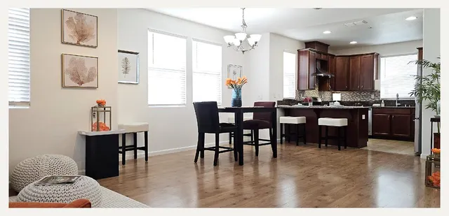 a kitchen with stainless steel appliances granite countertop a refrigerator a sink a stove a microwave and island