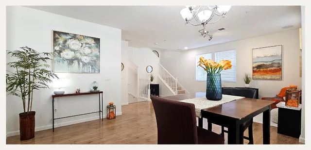 a kitchen with a granite countertop sink and a refrigerator