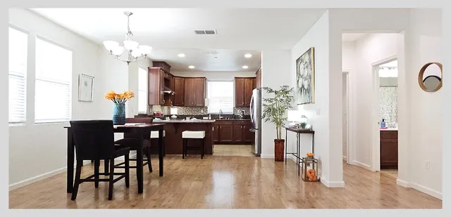 a kitchen with a sink stove and cabinets