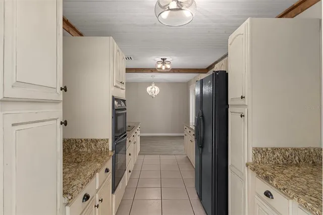 a view of hallway with chandelier