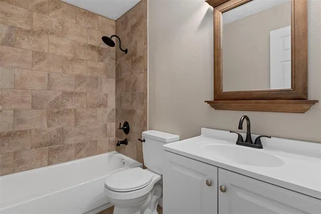 a bathroom with a sink a toilet and a bathtub