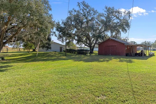 a view of a house with a big yard