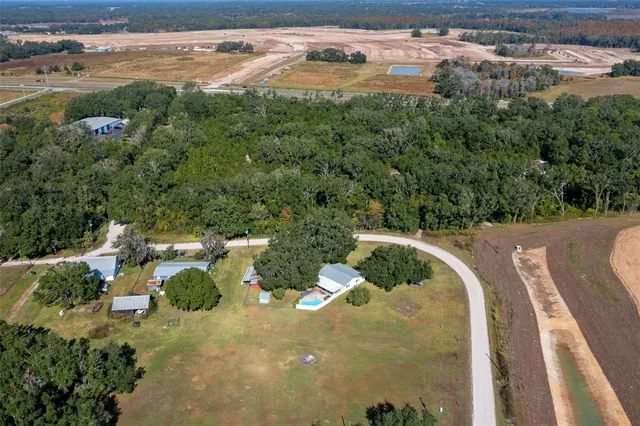 a view of a wooden house with a yard