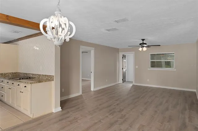 a view of a kitchen with a chandelier