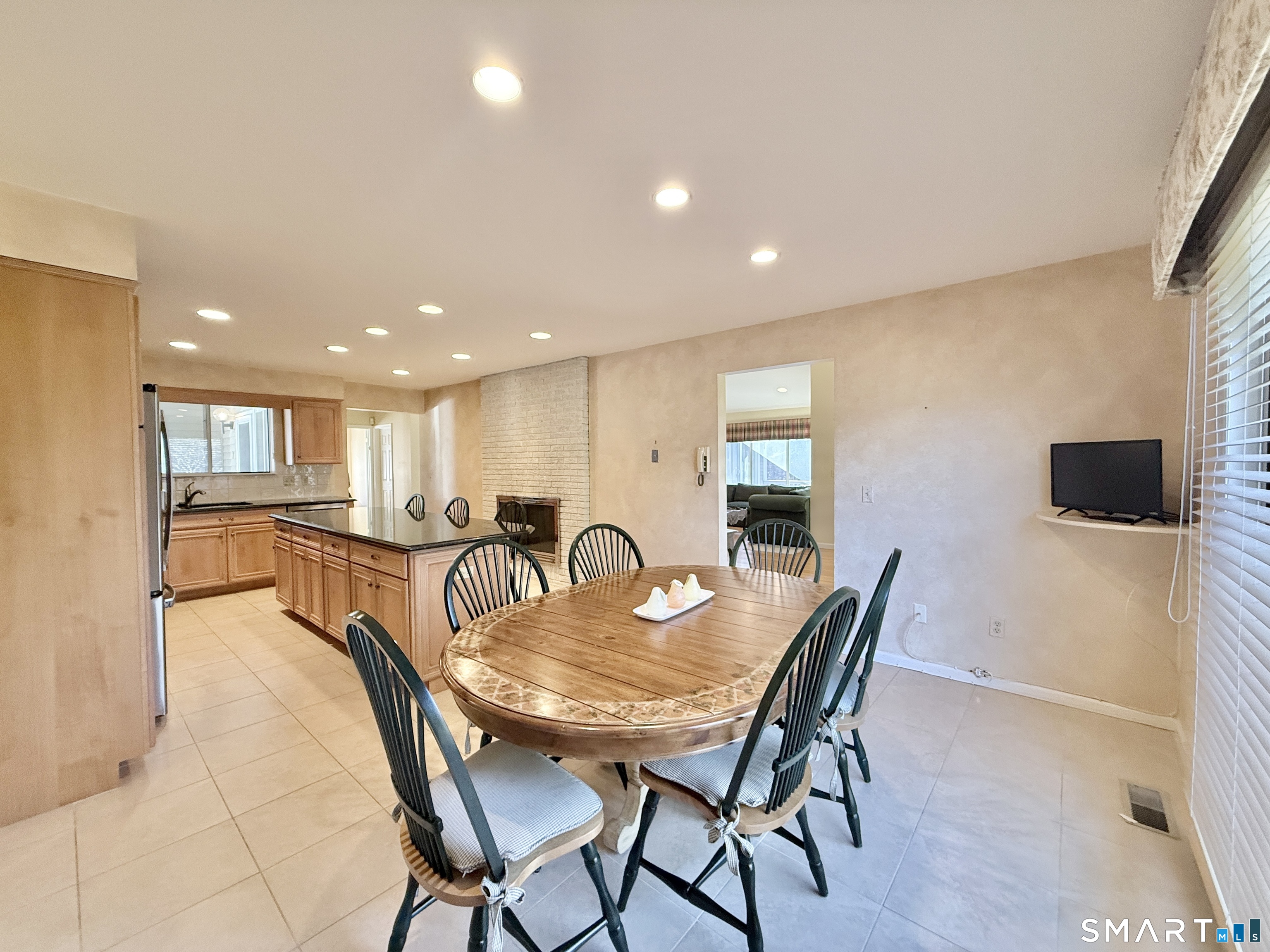 1 Alfred Lane Stamford, CT 06902 - Photo 19 of 35 a dining room with furniture and a flat screen tv