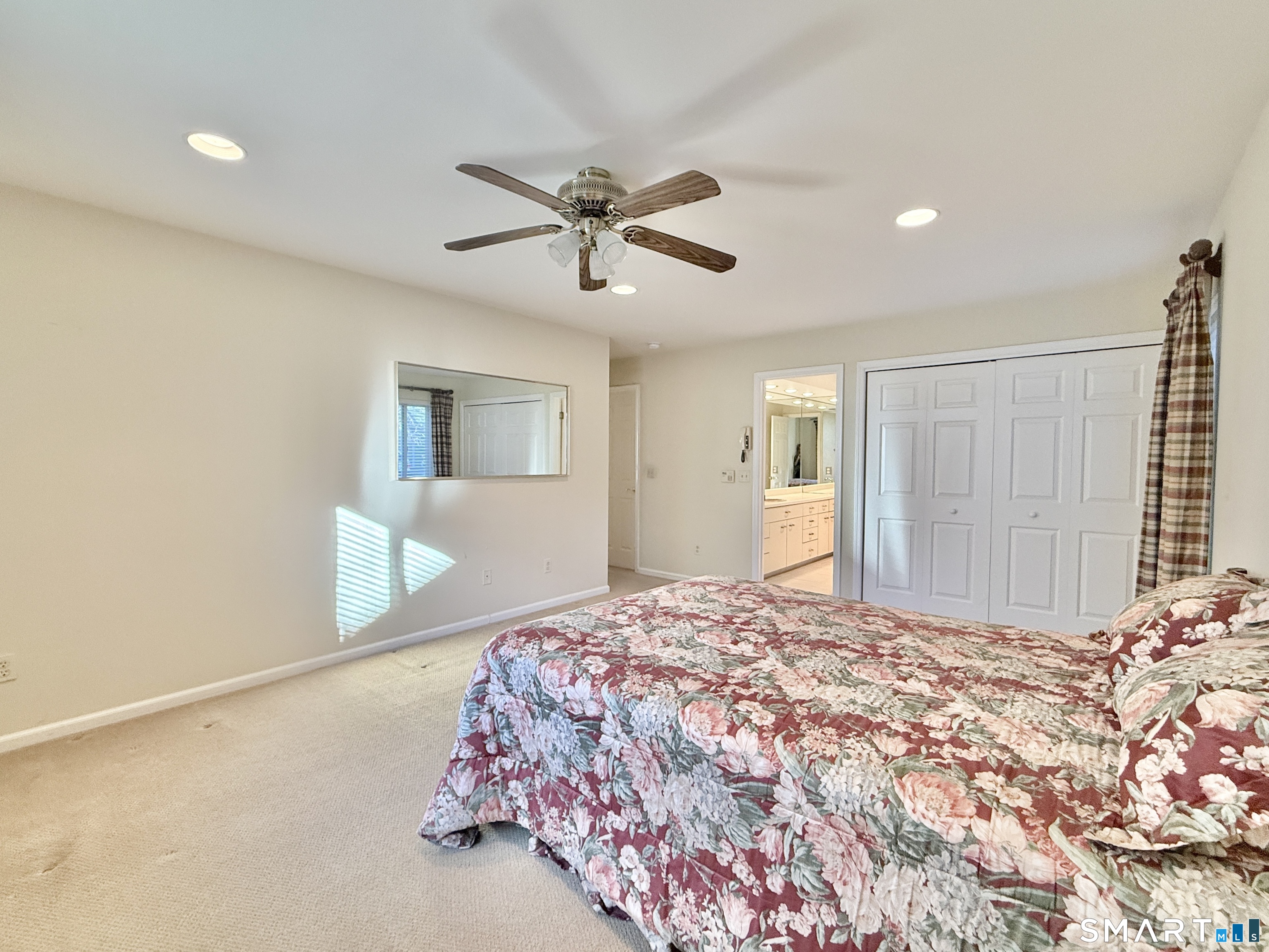 1 Alfred Lane Stamford, CT 06902 - Photo 22 of 35 a bedroom with a large bed and a chandelier
