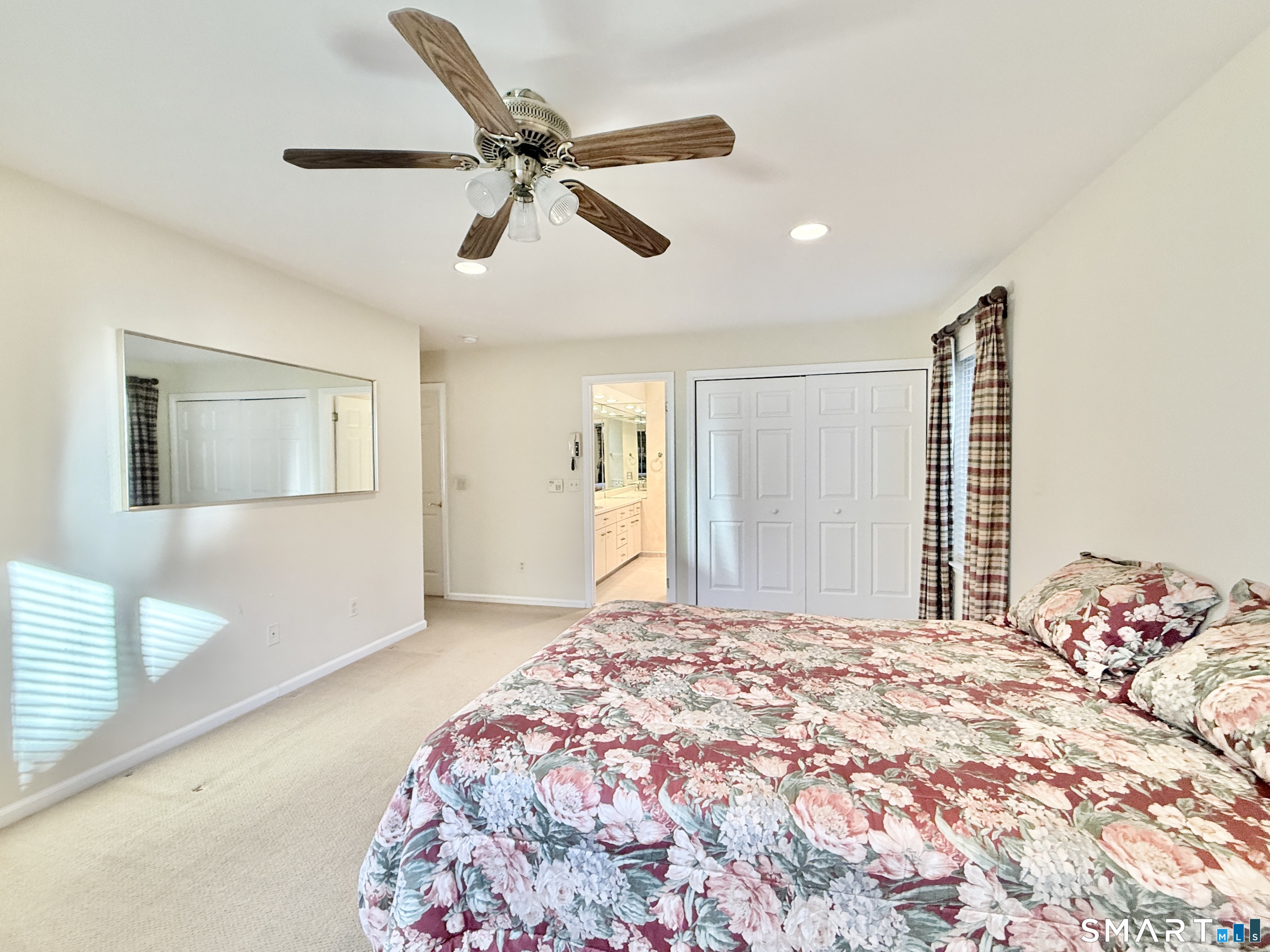 1 Alfred Lane Stamford, CT 06902 - Photo 23 of 35 a bedroom with a large bed and a chandelier