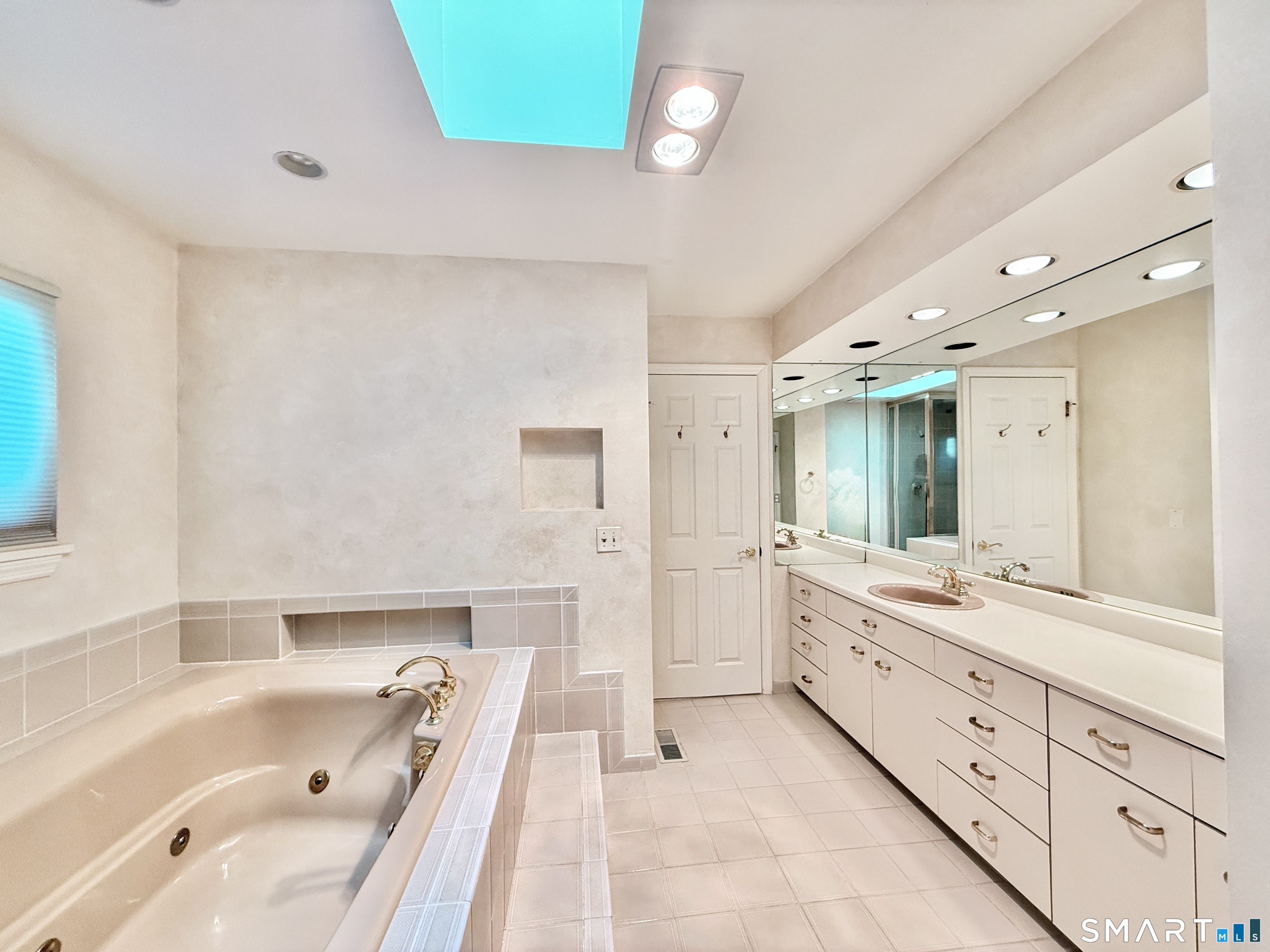 1 Alfred Lane Stamford, CT 06902 - Photo 26 of 35 a bathroom with a tub sink and mirror